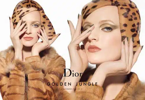 A woman in leopard print coat and makeup.