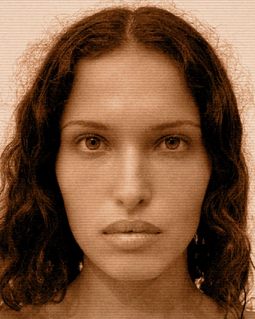 A woman with long hair and a brown background