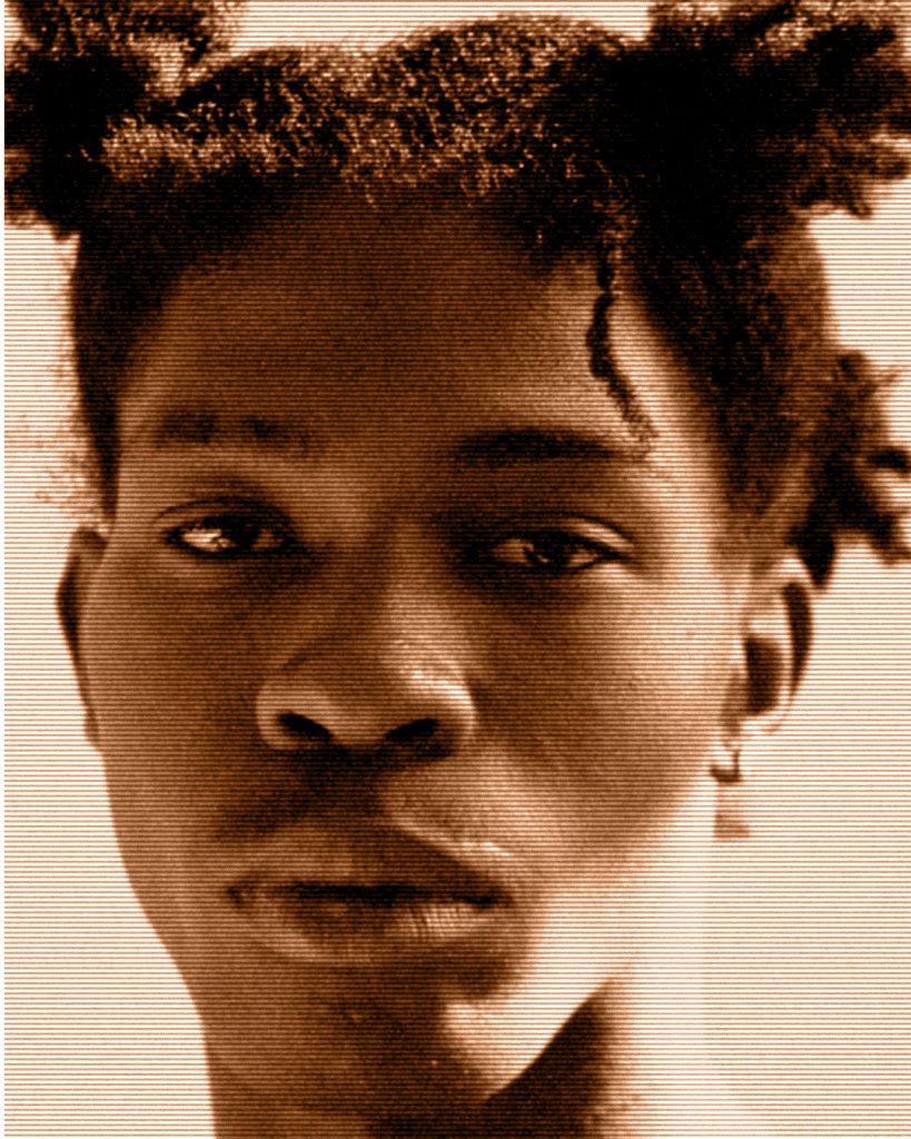A man with dreadlocks is looking at the camera.