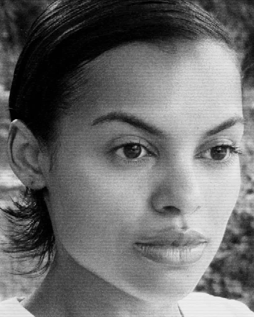 A black and white photo of a woman with short hair.