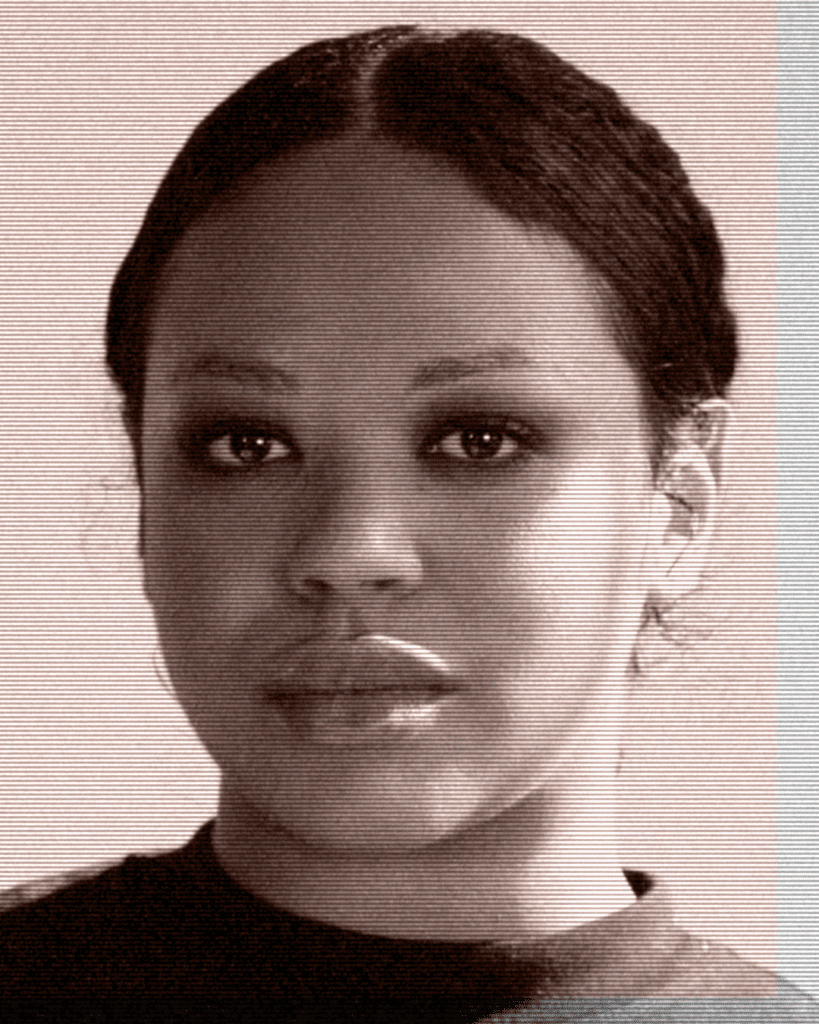 A woman with black hair and brown eyes.