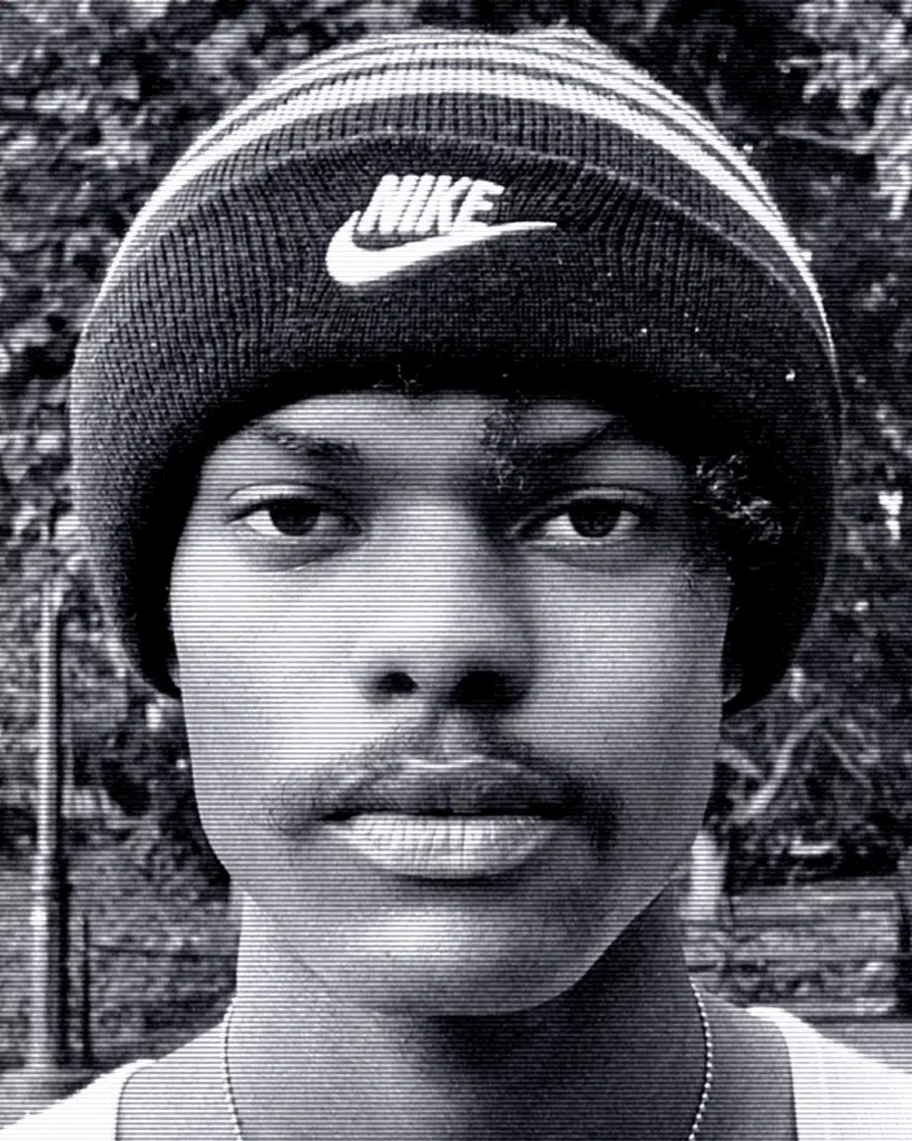 A man with a nike hat on.