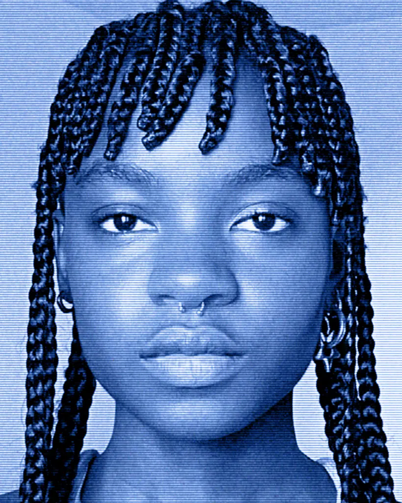 A young girl with braids and bangs.