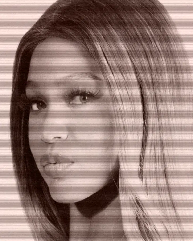 A black and white photo of a woman with long hair.