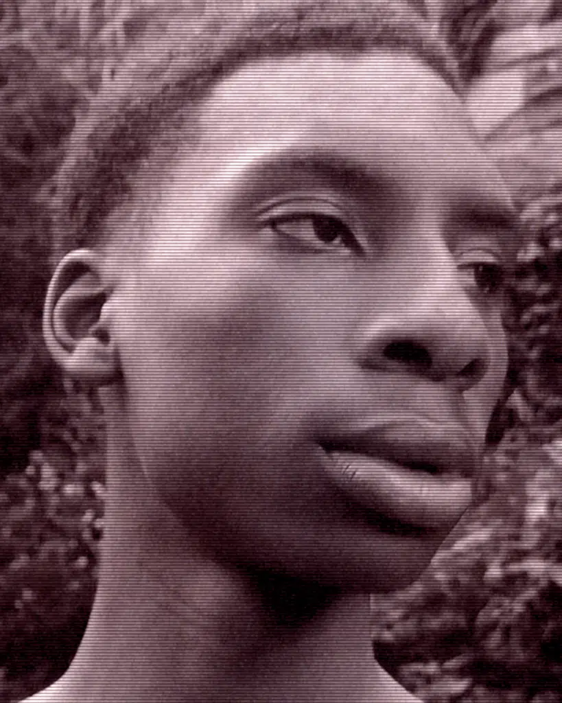 A black and white photo of a man 's face.