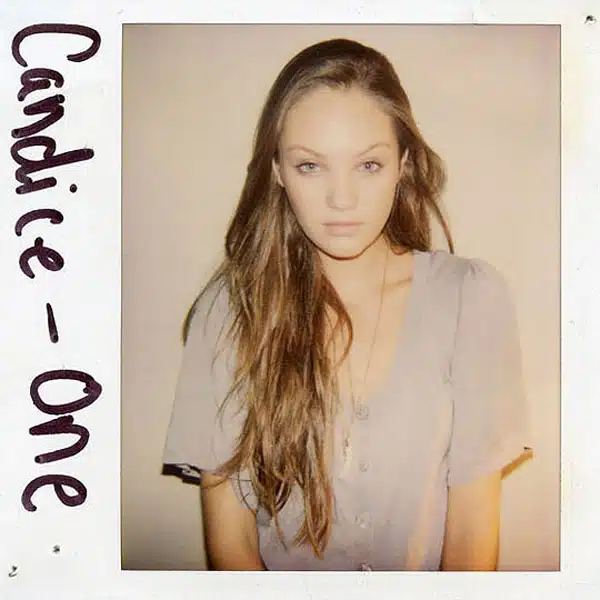 A polaroid picture of a woman with long hair.