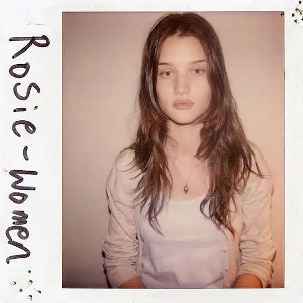 A polaroid picture of a girl with long hair.