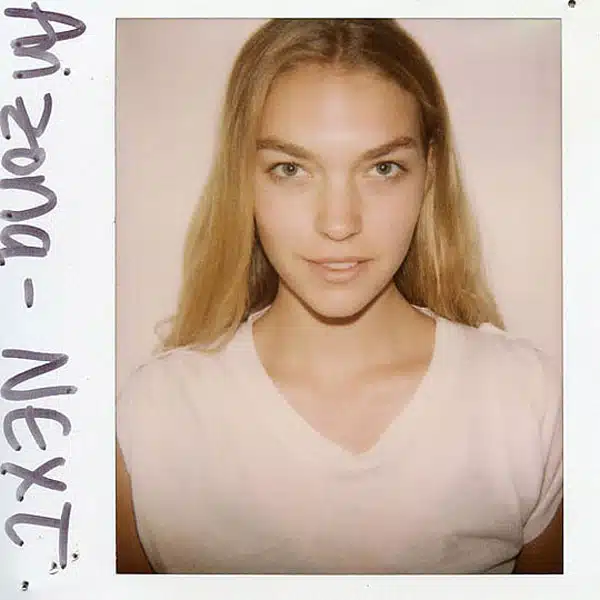 A polaroid picture of a woman with long hair.