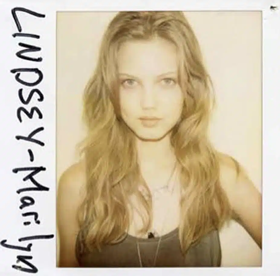 A polaroid picture of a woman with long hair.