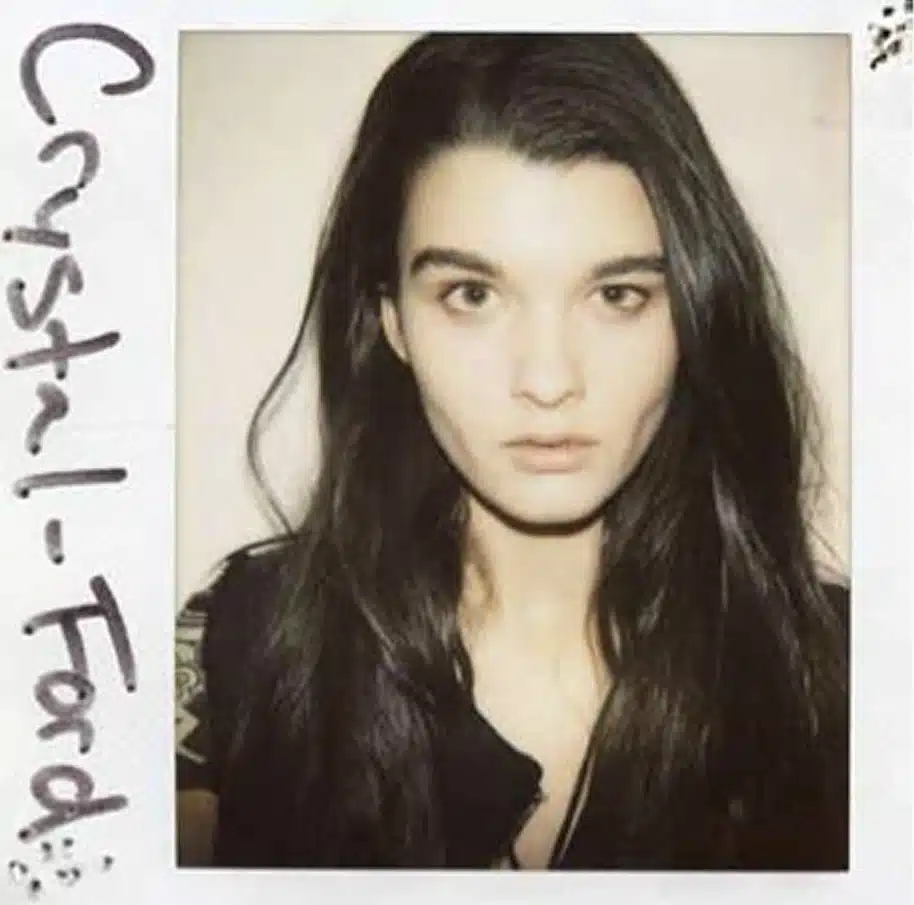 A polaroid picture of a woman with long hair.