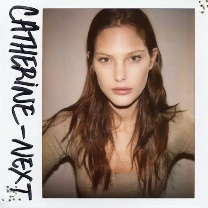 A polaroid of a woman with long hair.