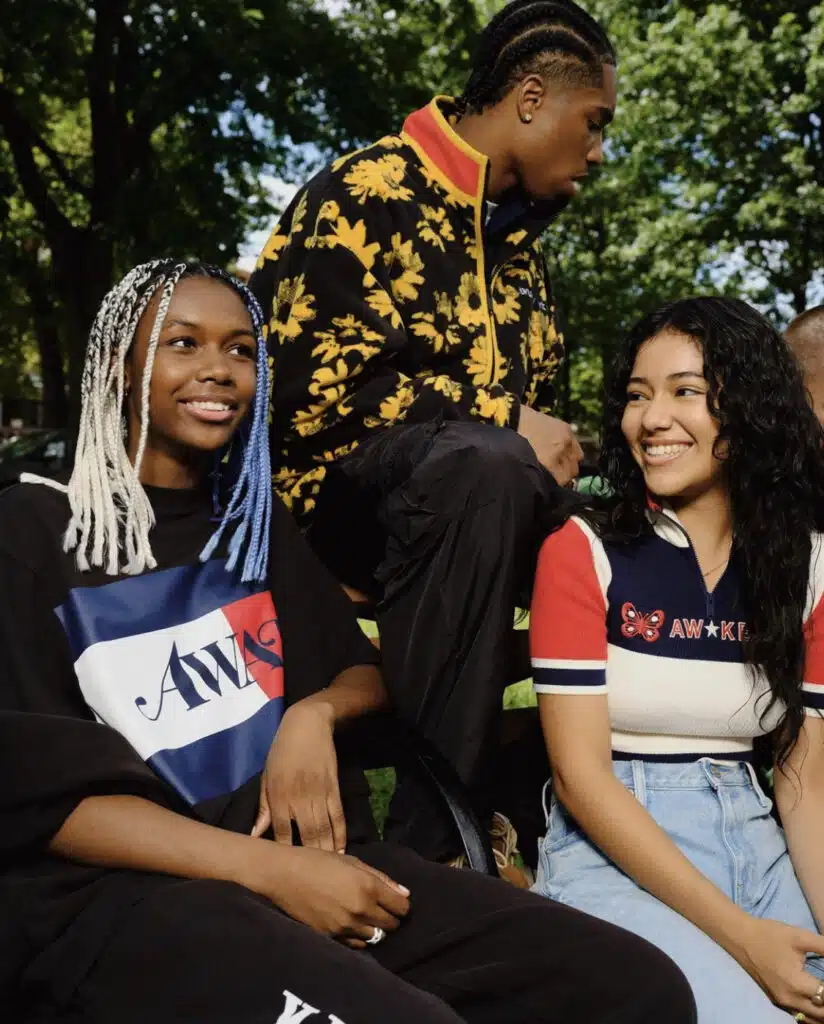 A group of people sitting on the ground.