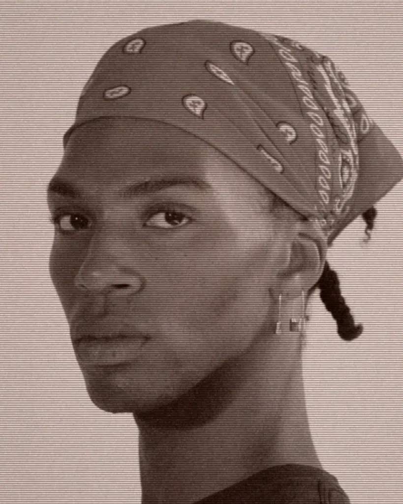 A man with a bandanna on his head.