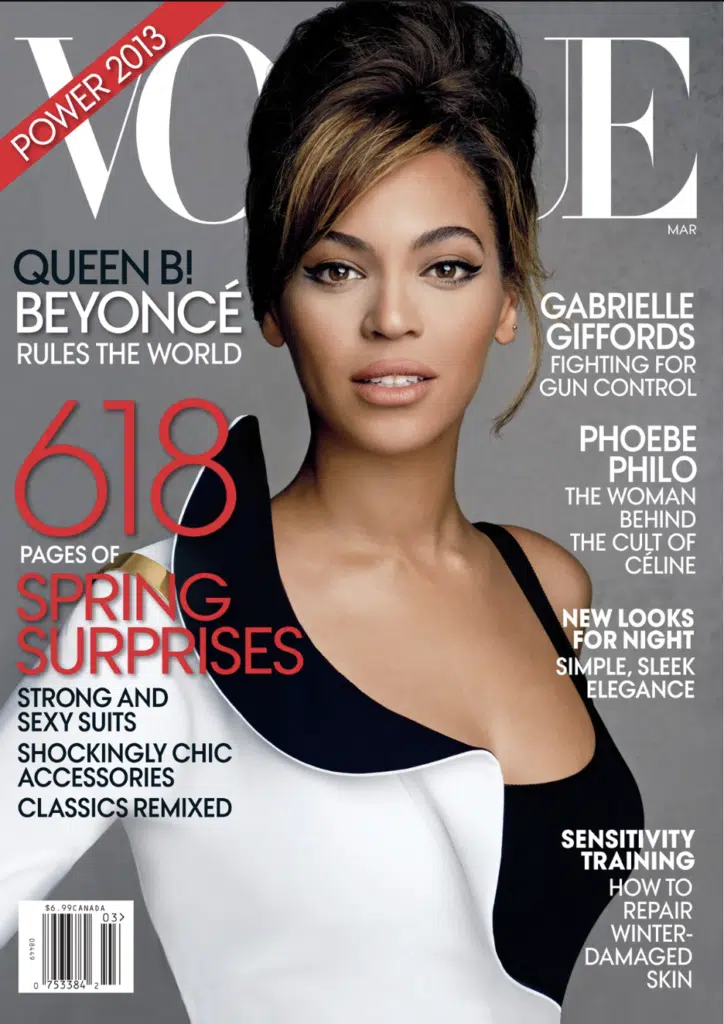 A woman in black and white dress on the cover of vogue.