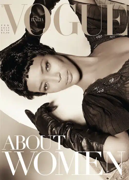 A woman wearing gloves and a hat on the cover of vogue.