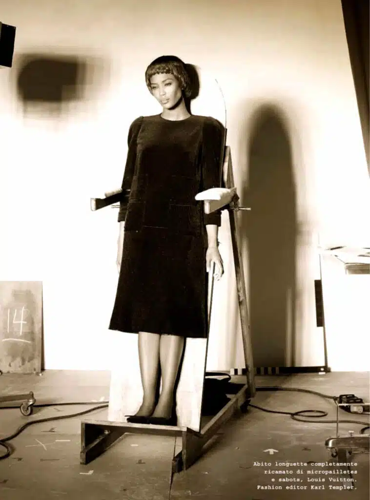 A woman standing on a scale in the middle of a room.