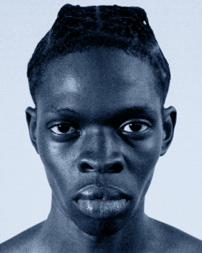 A man with very large eyes and dark skin.