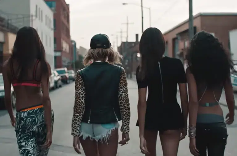 A group of women walking down the street.