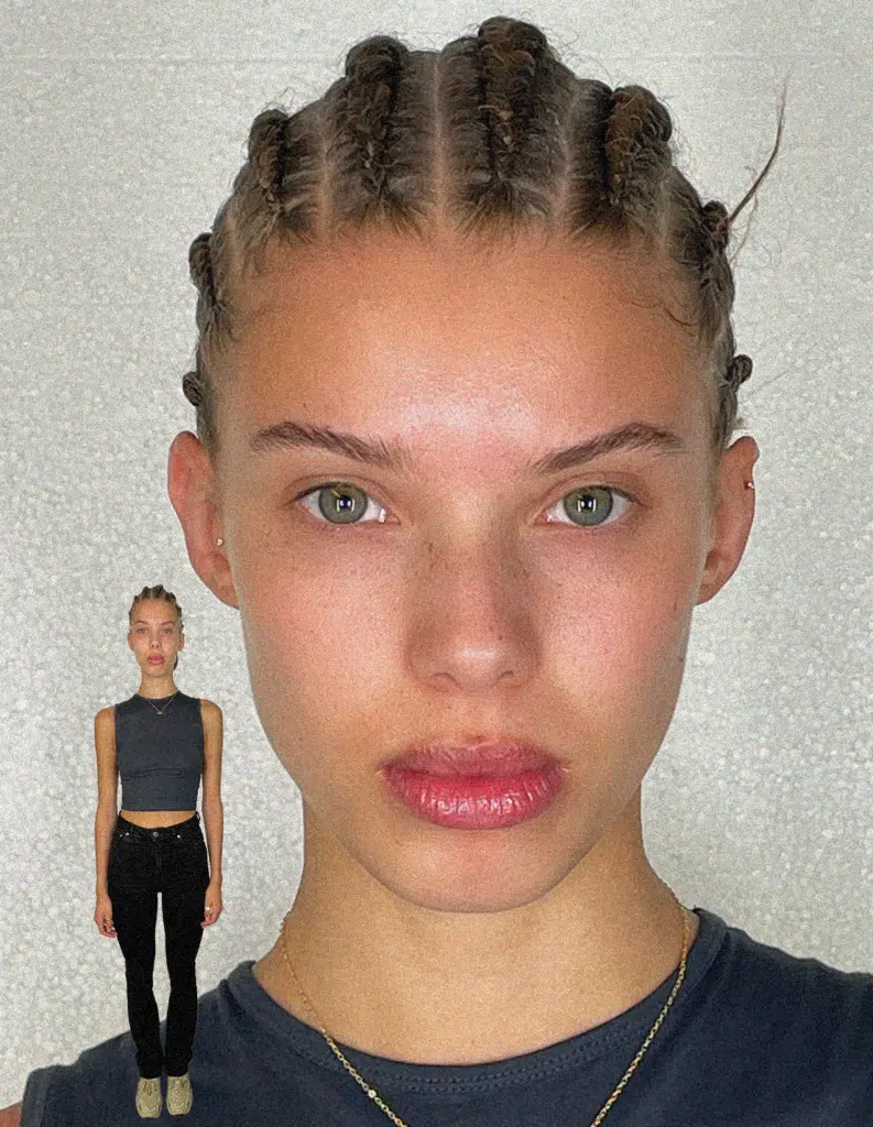 A woman with two braids and one is standing up