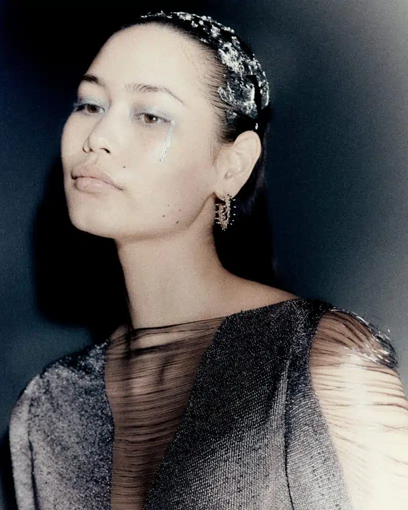 A woman with a flower in her hair.