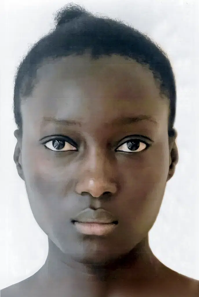 A woman with very large eyes and dark skin.