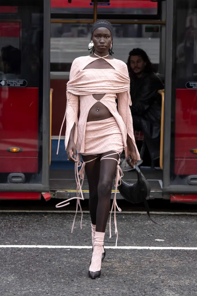 A woman in a dress walking down the street