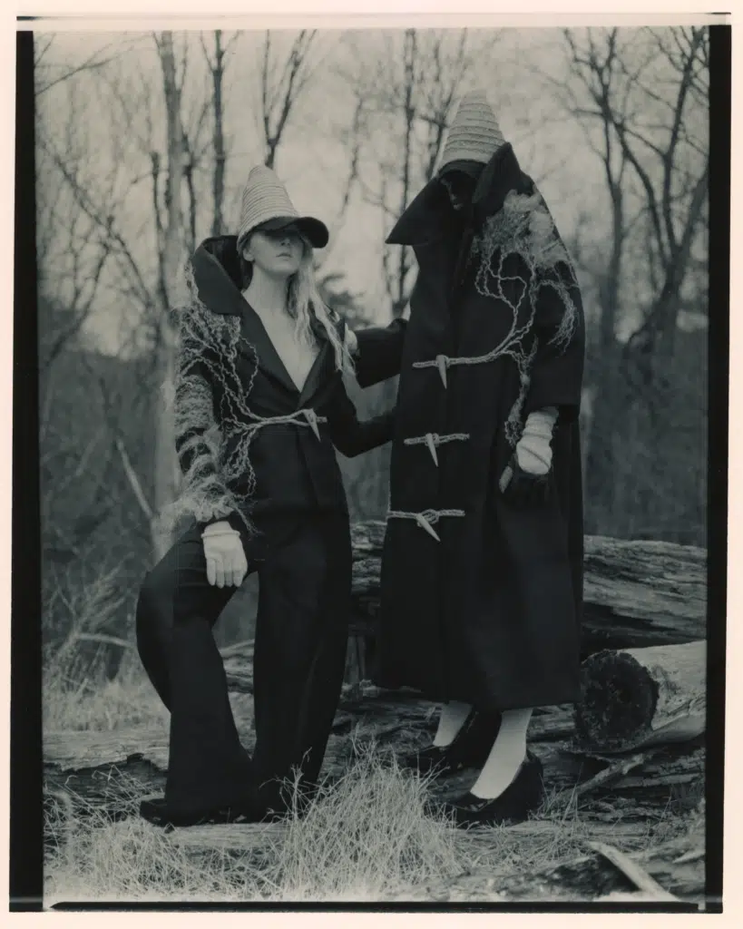 Two women in costumes standing next to each other.