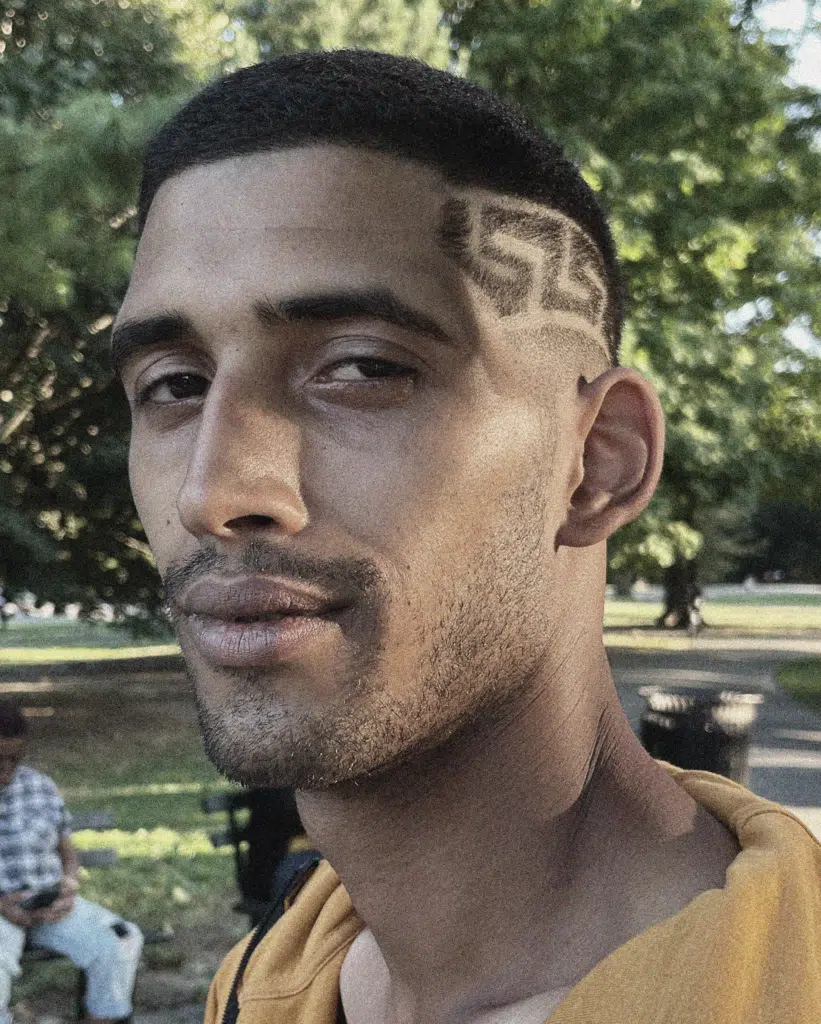 A man with a number on his forehead.