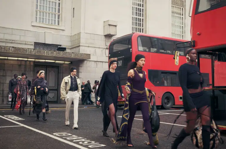 A group of people walking down the street